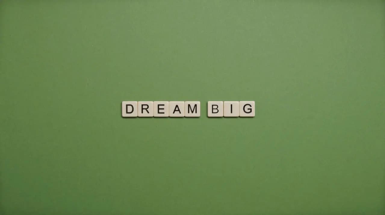 Scrabble tiles spelling out 'Think Big'